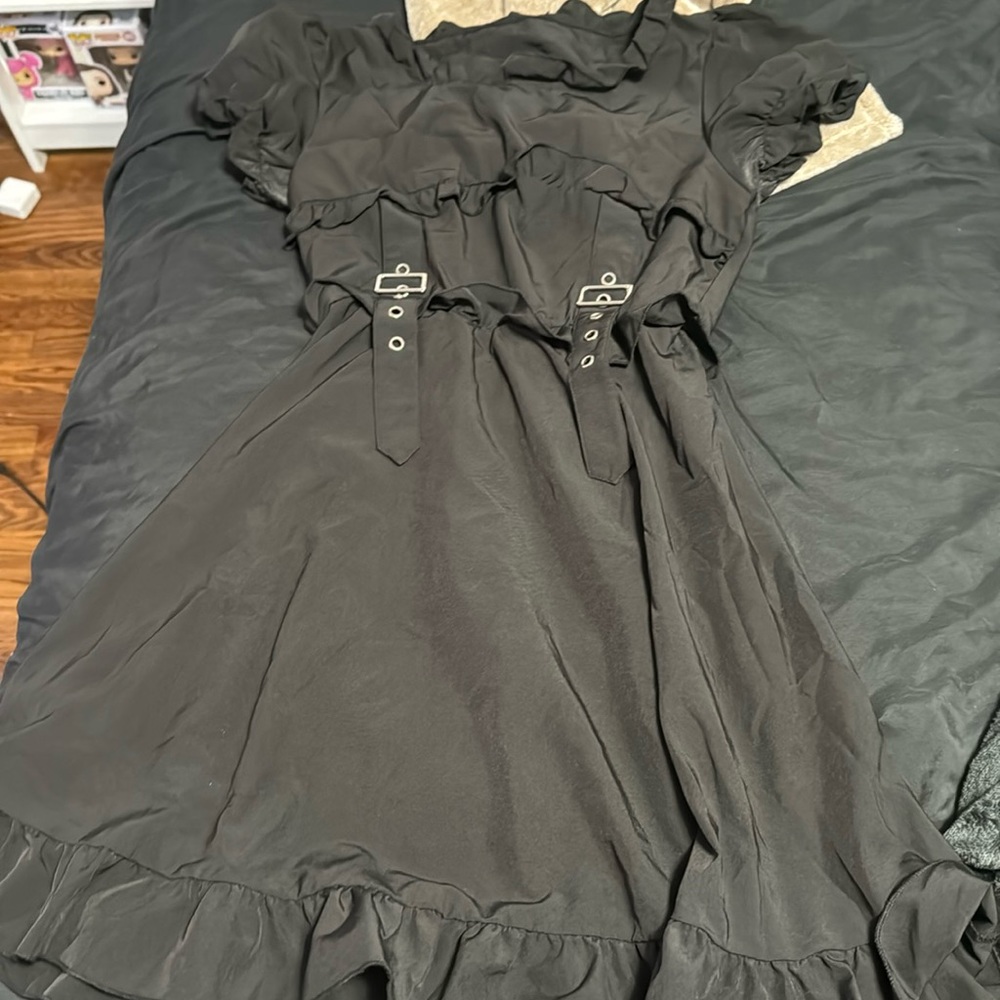 Black dress with mini belts on it